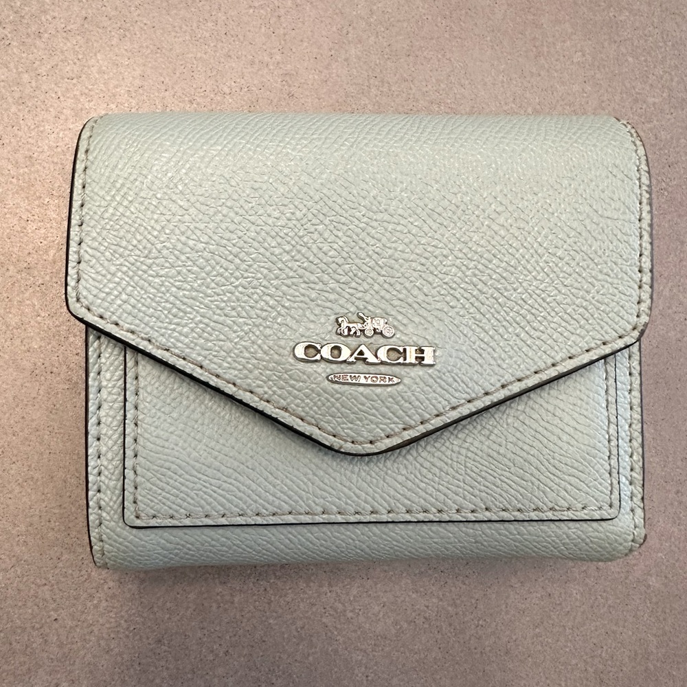 Small blue Coach leather bi-fold wallet